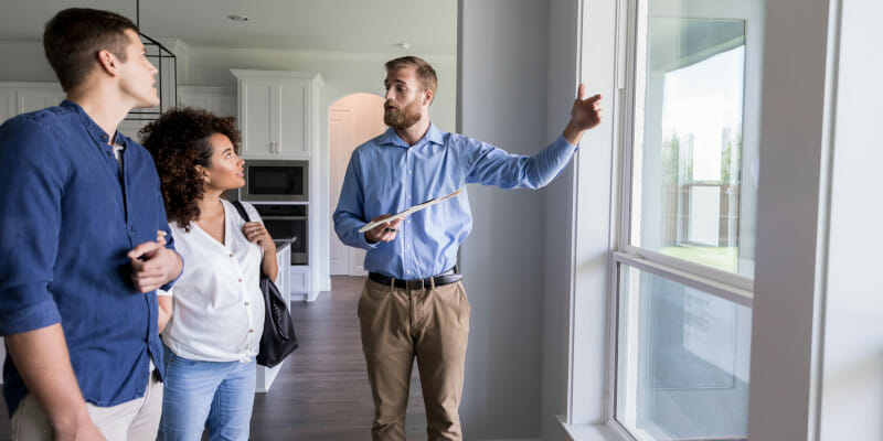 Realtor showing home to couple